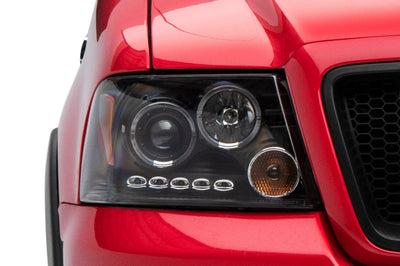 Raxiom 04-08 Ford F-150 Dual LED Halo Projector Headlights- Black Housing (Clear Lens) - Lights