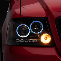 Raxiom 04-08 Ford F-150 Dual LED Halo Projector Headlights- Black Housing (Clear Lens) - Lights