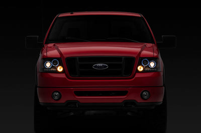 Raxiom 04-08 Ford F-150 Dual LED Halo Projector Headlights- Black Housing (Clear Lens) - Lights