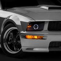 Raxiom 05-09 Ford Mustang Halogen 2010 Style LED Halo Headlights-Blk Hsng(Clear Lens/Excludes GT500) - Lights