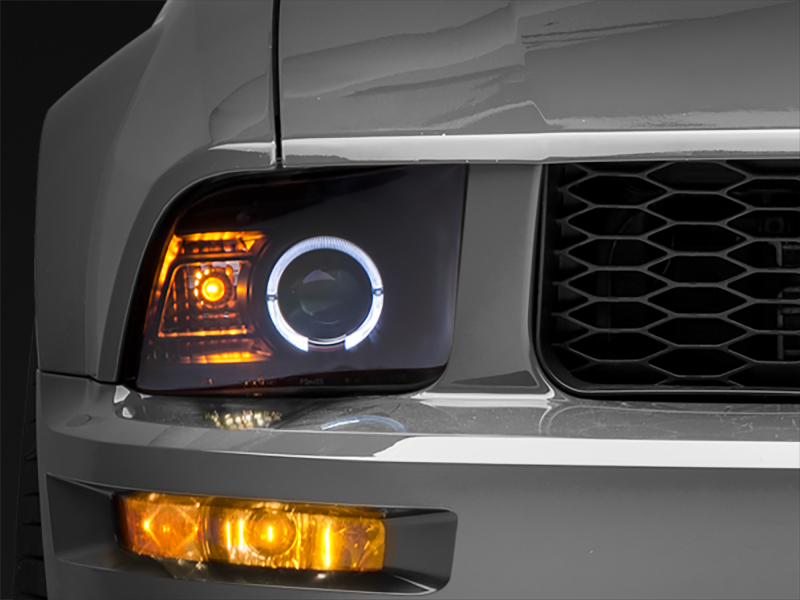 Raxiom 05-09 Ford Mustang Halogen 2010 Style LED Halo Headlights-Blk Hsng(Clear Lens/Excludes GT500) - Lights
