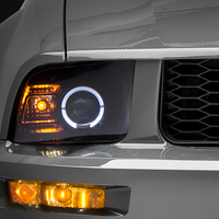 Raxiom 05-09 Ford Mustang Halogen 2010 Style LED Halo Headlights-Blk Hsng(Clear Lens/Excludes GT500) - Lights