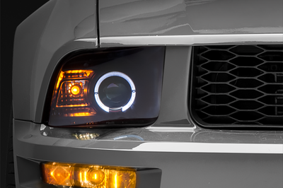 Raxiom 05-09 Ford Mustang Halogen 2010 Style LED Halo Headlights-Blk Hsng(Clear Lens/Excludes GT500) - Lights