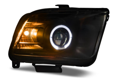 Raxiom 05-09 Ford Mustang Halogen 2010 Style LED Halo Headlights-Blk Hsng(Clear Lens/Excludes GT500) - Lights