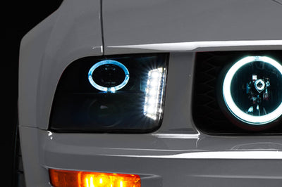Raxiom 05-09 Ford Mustang w/ Halogen LED Halo Prjctr Headlights-Blk Hsng(Smoked Lens Exclude GT500) - Lights