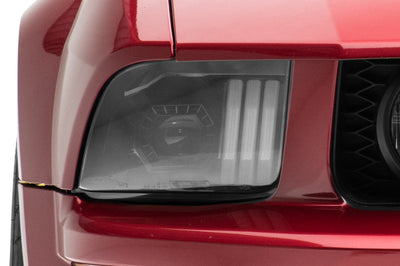 Raxiom 05-09 Ford Mustang w/ Halogen Prjctor Headlights- Black Housing (Clear Lens) (No GT500) Lights