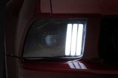 Raxiom 05-09 Ford Mustang w/ Halogen Prjctor Headlights- Black Housing (Clear Lens) (No GT500) Lights