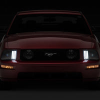 Raxiom 05-09 Ford Mustang w/ Halogen Prjctor Headlights- Black Housing (Clear Lens) (No GT500) Lights