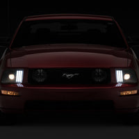 Raxiom 05-09 Ford Mustang w/ Halogen Prjctor Headlights- Black Housing (Clear Lens) (No GT500) Lights