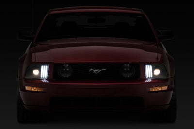 Raxiom 05-09 Ford Mustang w/ Halogen Prjctor Headlights- Black Housing (Clear Lens) (No GT500) Lights
