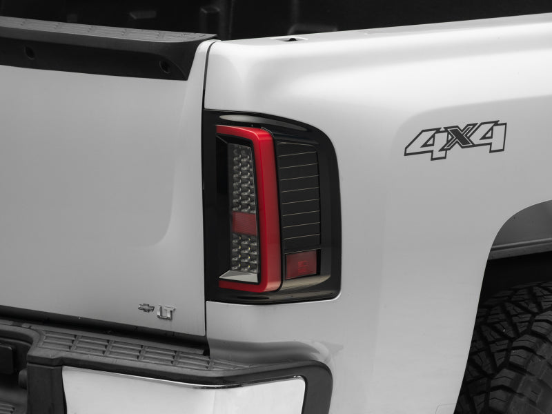 Raxiom 07-13 Chevy Silverado 1500 G2 LED Tail Lights- Black Housing (Clear Lens) - Lights