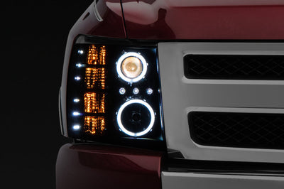 Raxiom 07-13 Silverado 1500 Super White LED Halo Projector Headlights- Black Housing (Clear Lens) - Lights