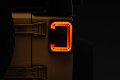Raxiom 07-18 Jeep Wrangler JK Axial Series LED Halo Tail Lights- Black Housing (Dark Smoked Lens) - Lights