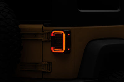 Raxiom 07-18 Jeep Wrangler JK Axial Series LED Halo Tail Lights- Black Housing (Dark Smoked Lens) - Lights