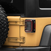 Raxiom 07-18 Jeep Wrangler JK Axial Series LED Halo Tail Lights- Black Housing (Dark Smoked Lens) - Lights