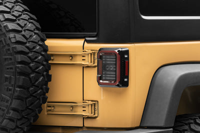 Raxiom 07-18 Jeep Wrangler JK Axial Series LED Halo Tail Lights- Black Housing (Dark Smoked Lens) - Lights