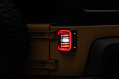 Raxiom 07-18 Jeep Wrangler JK Axial Series LED Halo Tail Lights- Black Housing (Dark Smoked Lens) - Lights