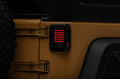 Raxiom 07-18 Jeep Wrangler JK LED Tail Lights- Black Housing (Smoked Lens) - Lights