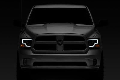 Raxiom 09-18 Dodge RAM 1500 LED Bar Headlights- Black Housing (Clear Lens) - Lights