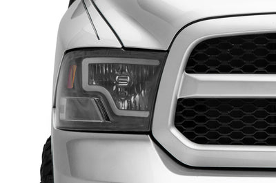 Raxiom 09-18 Dodge RAM 1500 LED Bar Headlights- Black Housing (Clear Lens) - Lights