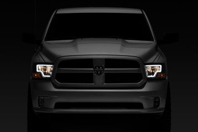 Raxiom 09-18 Dodge RAM 1500 LED Bar Headlights- Black Housing (Clear Lens) - Lights