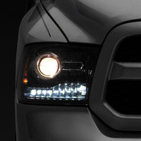 Raxiom 09-18 Dodge RAM 1500 LED Halo Headlights w/Switchback Turn Signals- Blk Housing (Clear Lens) - Lights