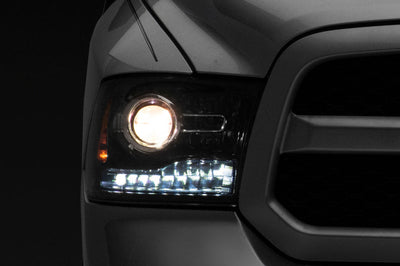 Raxiom 09-18 Dodge RAM 1500 LED Halo Headlights w/Switchback Turn Signals- Blk Housing (Clear Lens) - Lights