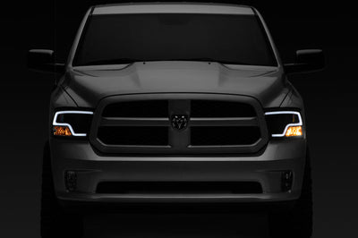 Raxiom 09-18 RAM 1500 LED Halo Projector Headlights- Black Housing (Clear Lens) - Lights