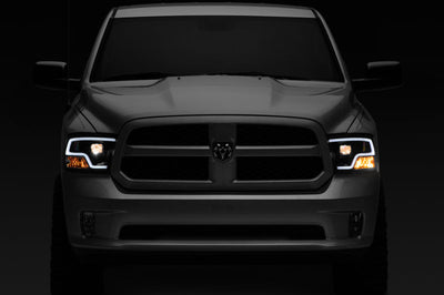 Raxiom 09-18 RAM 1500 LED Halo Projector Headlights- Black Housing (Clear Lens) - Lights