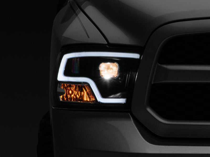 Raxiom 09-18 RAM 1500 LED Halo Projector Headlights- Black Housing (Clear Lens) - Lights