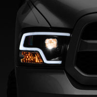 Raxiom 09-18 RAM 1500 LED Halo Projector Headlights- Black Housing (Clear Lens) - Lights