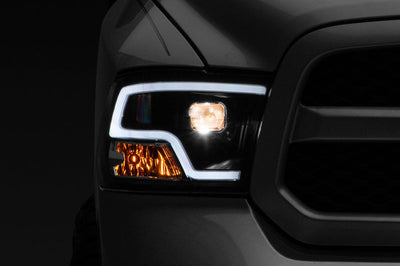 Raxiom 09-18 RAM 1500 LED Halo Projector Headlights- Black Housing (Clear Lens) - Lights