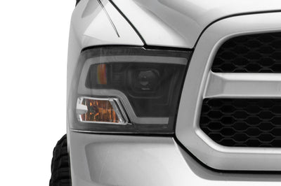 Raxiom 09-18 RAM 1500 LED Halo Projector Headlights- Black Housing (Clear Lens) - Lights