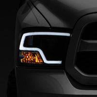 Raxiom 09-18 RAM 1500 LED Halo Projector Headlights- Black Housing (Clear Lens) - Lights