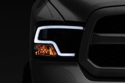 Raxiom 09-18 RAM 1500 LED Halo Projector Headlights- Black Housing (Clear Lens) - Lights