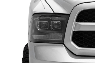 Raxiom 09-18 RAM 1500 LED Projector Headlights w/ Switchback Turn Signals- Blk Housing (Clear Lens) - Lights