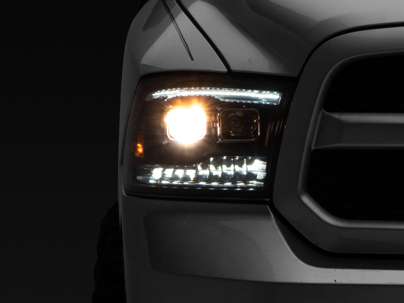 Raxiom 09-18 RAM 1500 LED Projector Headlights w/ Switchback Turn Signals- Blk Housing (Clear Lens) - Lights