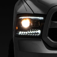Raxiom 09-18 RAM 1500 LED Projector Headlights w/ Switchback Turn Signals- Blk Housing (Clear Lens) - Lights