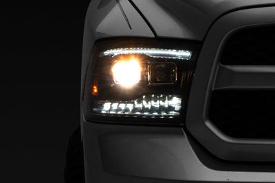 Raxiom 09-18 RAM 1500 LED Projector Headlights w/ Switchback Turn Signals- Blk Housing (Clear Lens) - Lights
