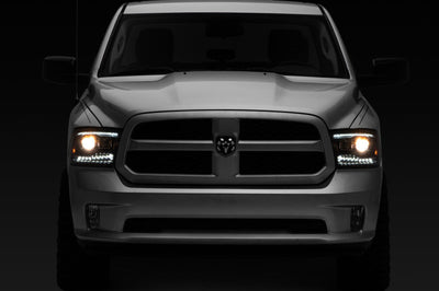 Raxiom 09-18 RAM 1500 LED Projector Headlights w/ Switchback Turn Signals- Blk Housing (Clear Lens) - Lights