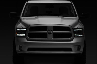 Raxiom 09-18 RAM 1500 LED Projector Headlights w/ Switchback Turn Signals- Blk Housing (Clear Lens) - Lights