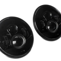 Raxiom 97-18 Jeep Wrangler TJ/JK Axial Series LED Daymaker Headlights- Black Housing (Clear Lens) - Lights