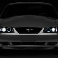 Raxiom 99-04 Ford Mustang Dual LED Halo Projector Headlights- Black Housing (Smoked Lens) - Lights