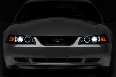 Raxiom 99-04 Ford Mustang Dual LED Halo Projector Headlights- Black Housing (Smoked Lens) - Lights