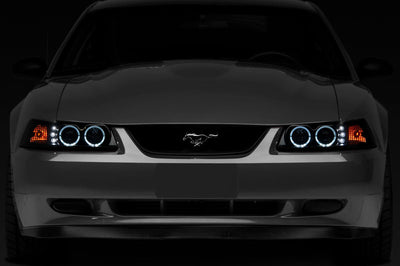 Raxiom 99-04 Ford Mustang Dual LED Halo Projector Headlights- Black Housing (Smoked Lens) - Lights