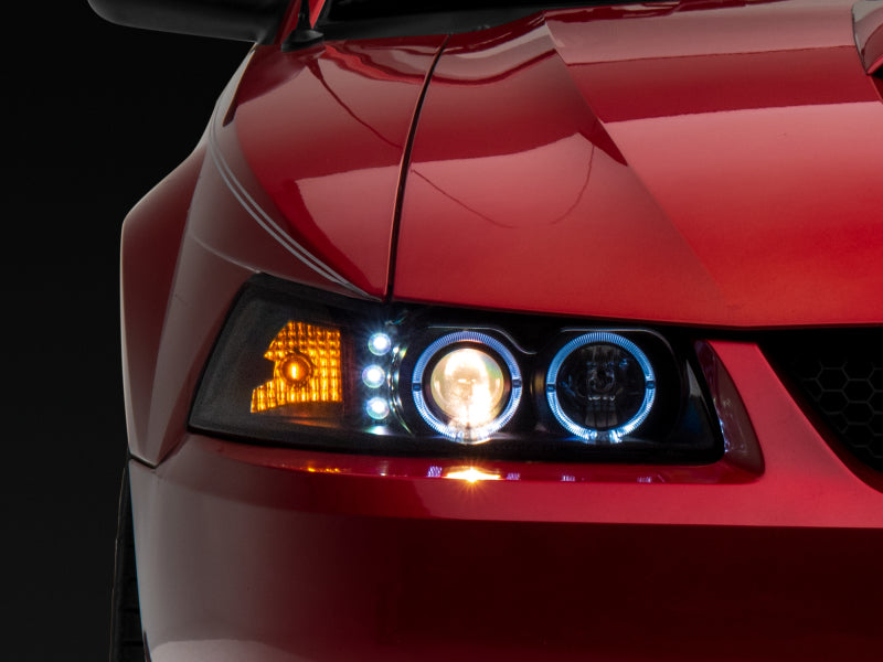 Raxiom 99-04 Ford Mustang Dual LED Halo Projector Headlights- Black Housing (Clear Lens) - Lights