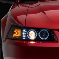 Raxiom 99-04 Ford Mustang Dual LED Halo Projector Headlights- Black Housing (Clear Lens) - Lights