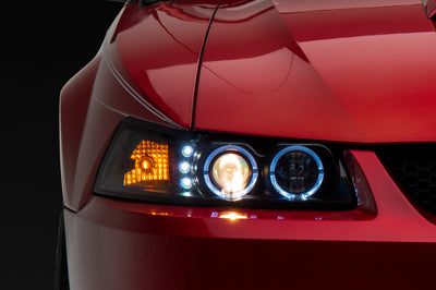Raxiom 99-04 Ford Mustang Dual LED Halo Projector Headlights- Black Housing (Clear Lens) - Lights