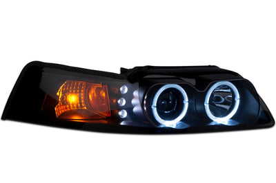 Raxiom 99-04 Ford Mustang Dual LED Halo Projector Headlights- Black Housing (Smoked Lens) - Lights