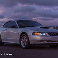 Raxiom 99-04 Ford Mustang Dual LED Halo Projector Headlights- Black Housing (Smoked Lens) - Lights